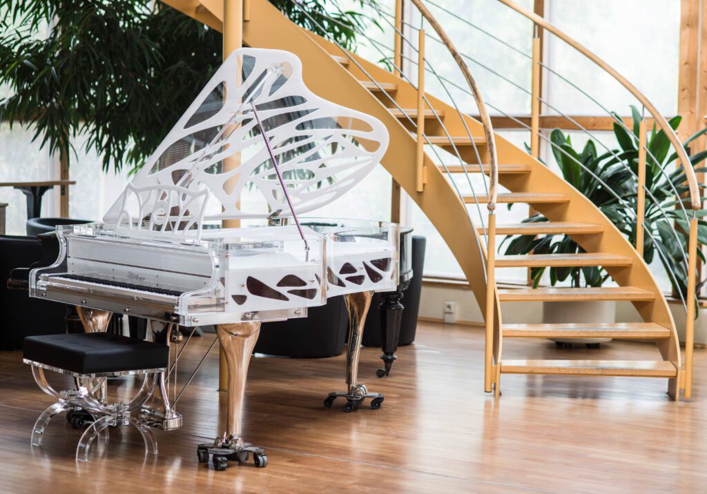 Bluthner Grand Piano at bottom of spiral staircase